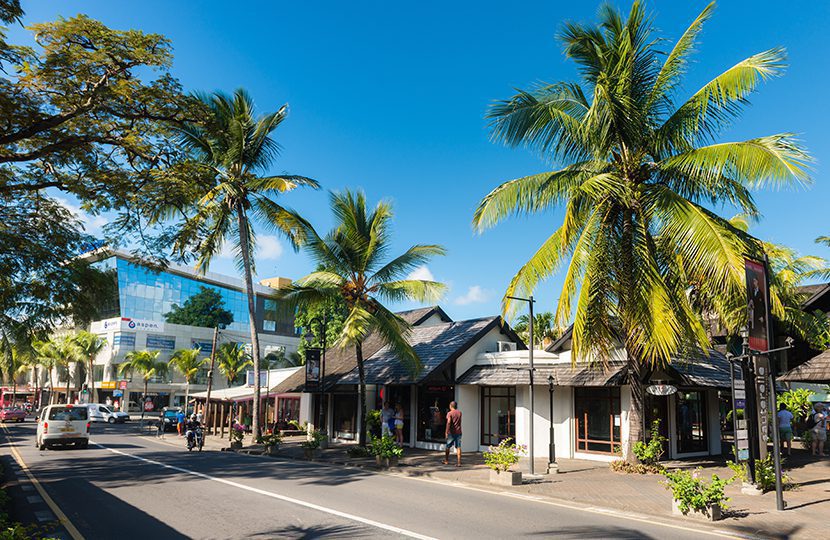 Royal Road of seaside city of Grand-Baie in Mauritius Island. Beautiful weather in coastal city of tropical island by Karl Ahnee